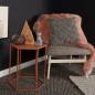 Preview: Gemütlicher Sessel und roter Beistelltisch auf stylischem, geknüpftem Wollteppich in dunkelgrau von heineking24